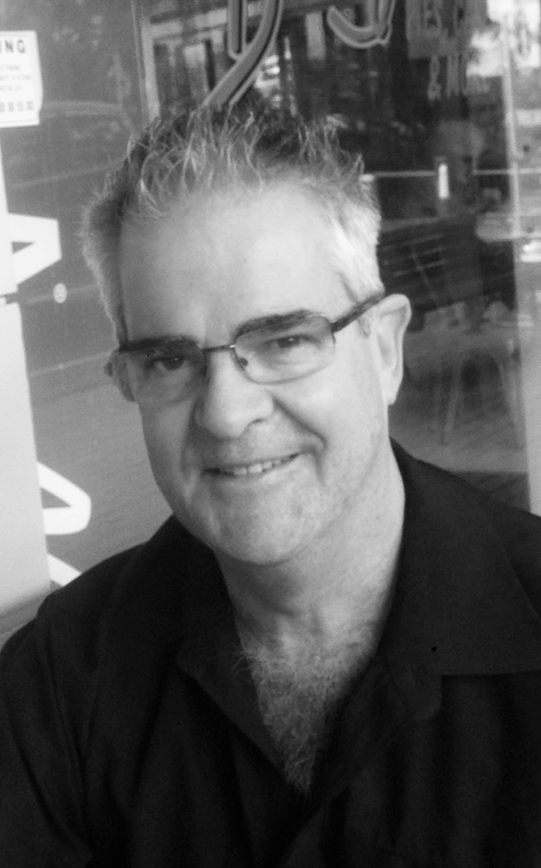 Headshot image of SELL – Geoffrey Raymond