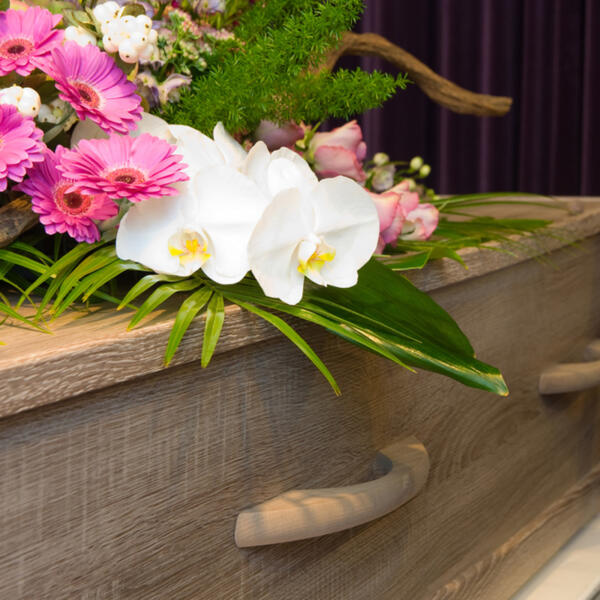 Coffin with flowers at Drysdale funeral parlor