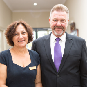 Male and female Geelong funeral directors standing side by side